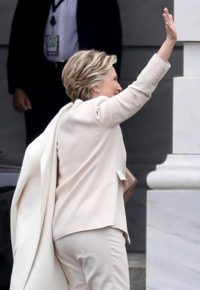 Wearing a cream suit, Hillary greeted the crowds