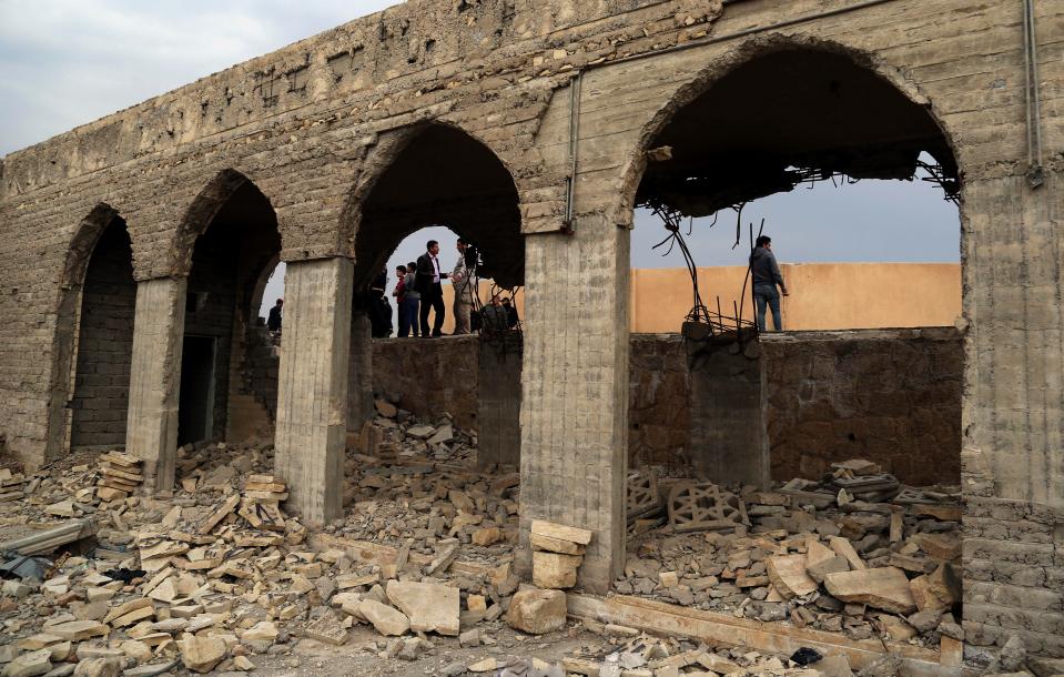  Caution (21/01/2017 at 16:15 ) Included in subscription People inspect the destroyed Mosque of The Prophet Younis, or Jonah, in Mosul