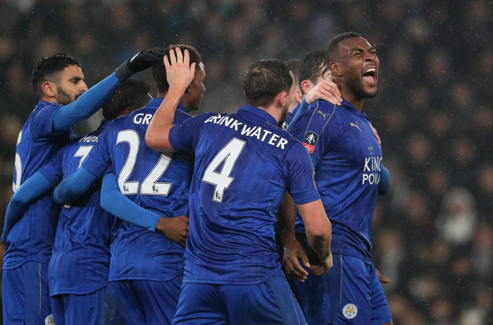 Leicester celebrate with skipper Wes Morgan after he powered home the equaliser