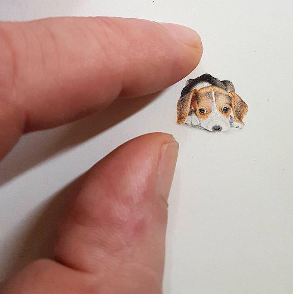 Fingers show how small the sketch is 