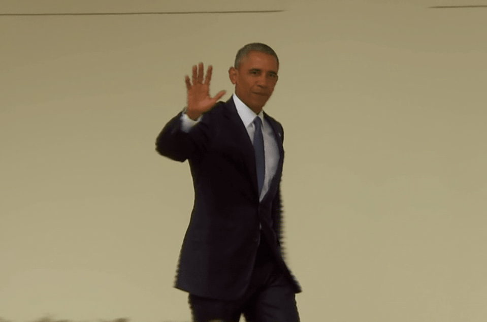 Obama waved to the photographers 