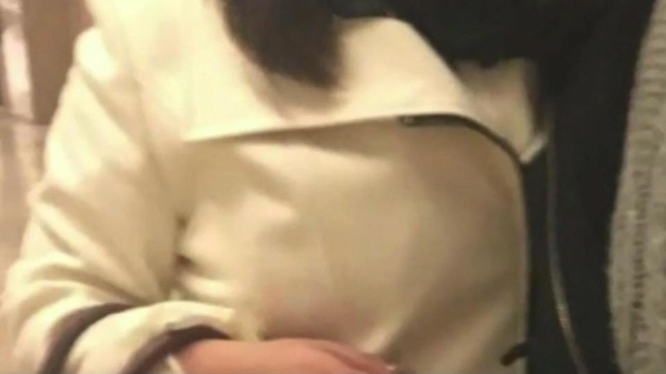 The woman claims she then covered up in this coat due to her embarrassment 