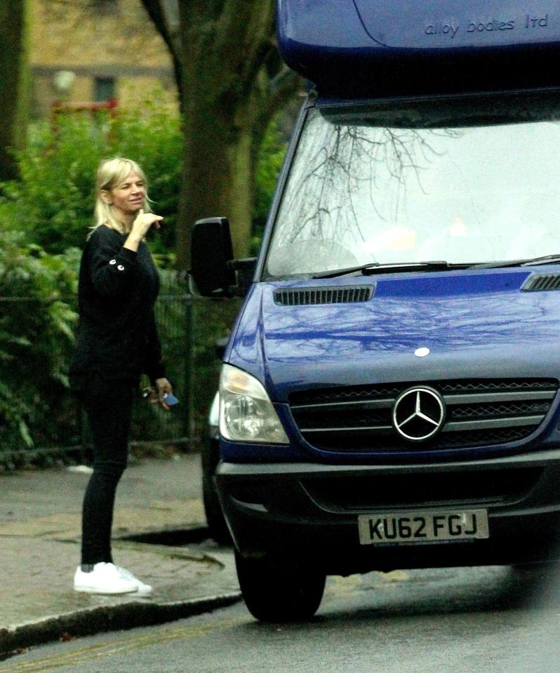  She gave him a hand as he moved his belongings in from the van