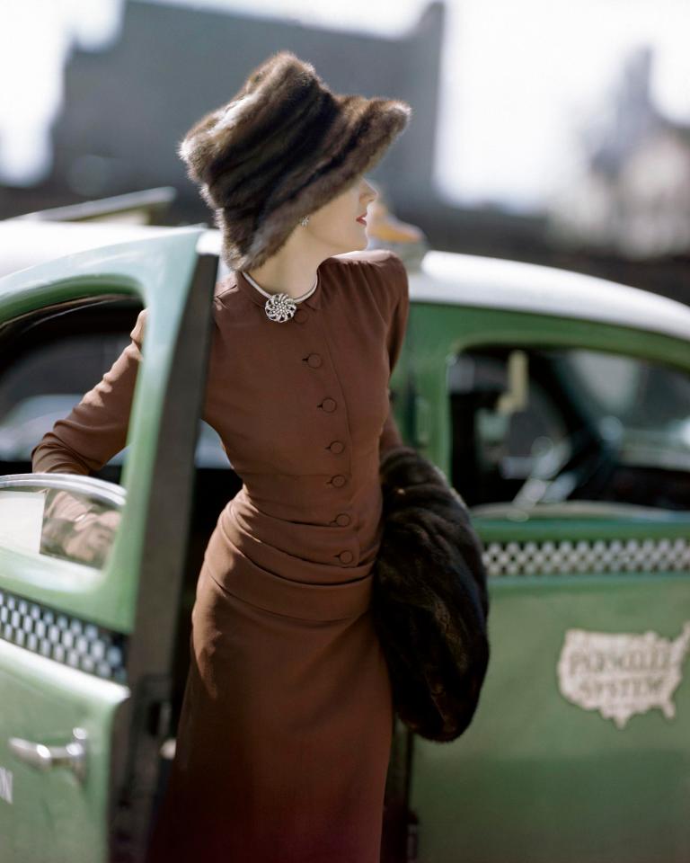  Model wearing a tight-fitting brown rayon dress with draped torso, a Vogue pattern, together with mink fur hat (Constantin Joffé, American Vogue, September 1945 © 1945 Condé Nast)