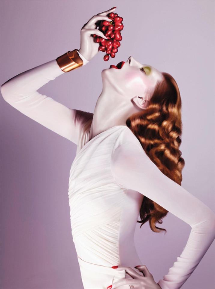  A striking portrait sees a porcelain-skinned model throw her head back as she prepares to nibble on a bunch of red grapes (Sølve Sundsbø, Love, Spring/Summer 2011 © Sølve Sundsbø/Art + Commerce)