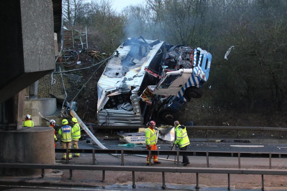 The lorry burst into flames shortly after crashing on to the road below