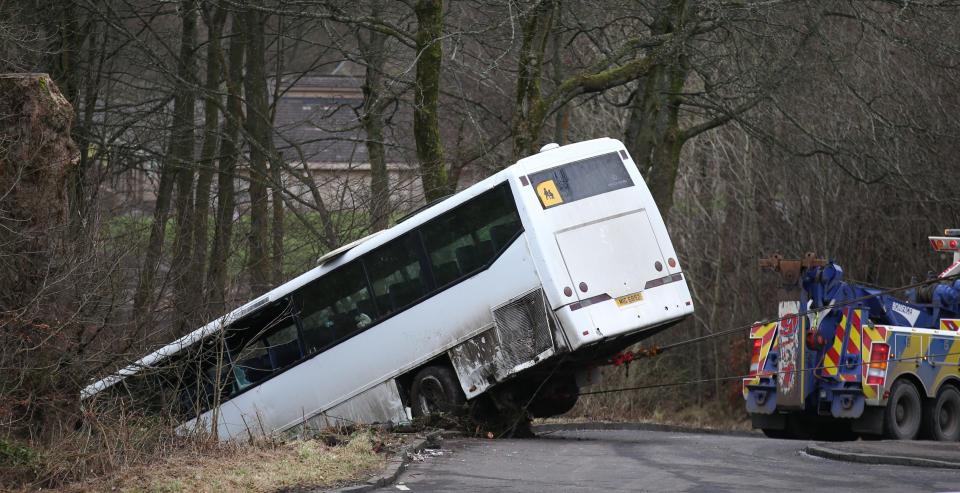  The bus was towed out of the ditch this afternoon after 22 pupils were taken to hospital