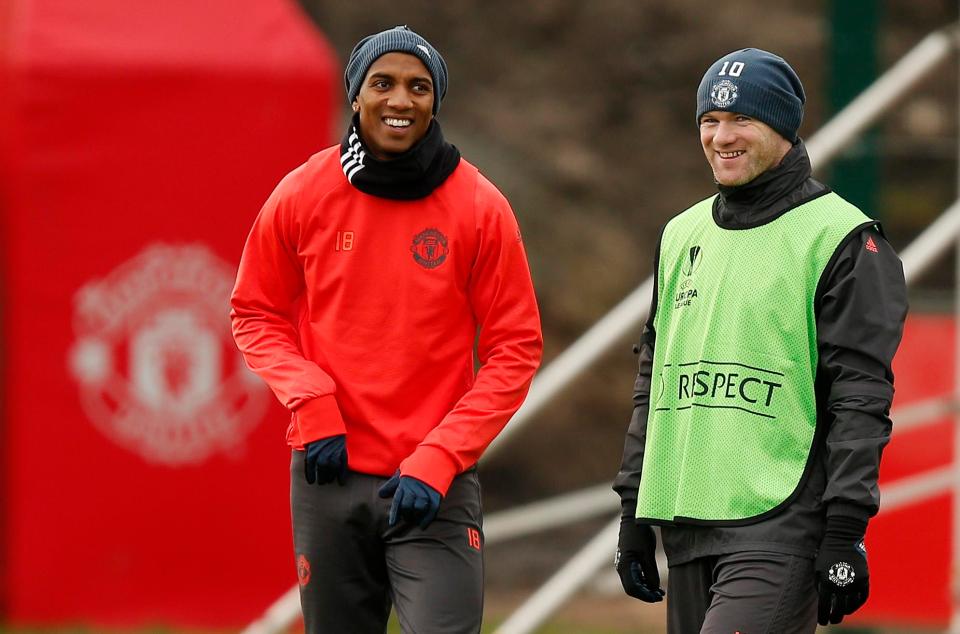 Rooney trains with Ashley Young at Manchester United's Carrington base on Tuesday