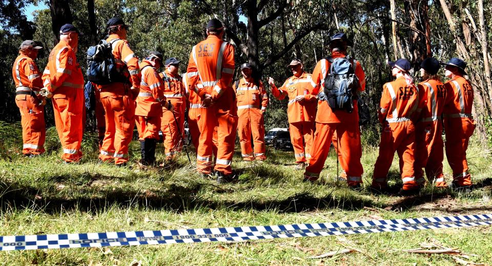  Police search the scene where the body was found for clues