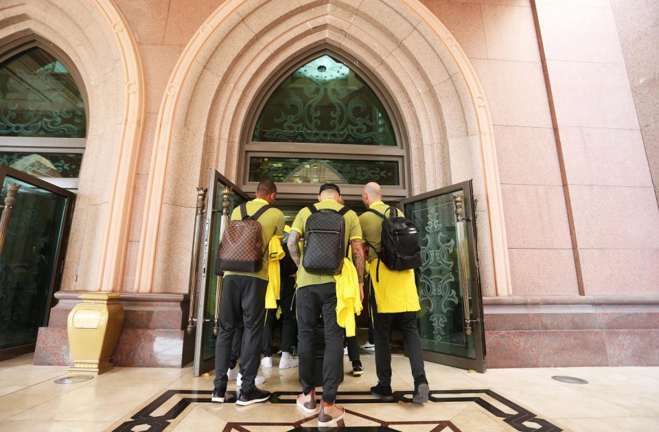 The Manchester City players enter the luxurious Emirates Palace Abu Dhabi on their warm-weather training break