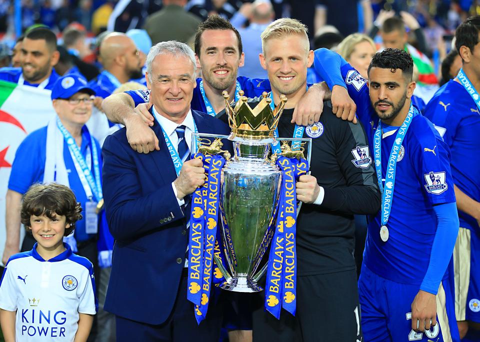 Ranieri with his players and the Prem trophy last May