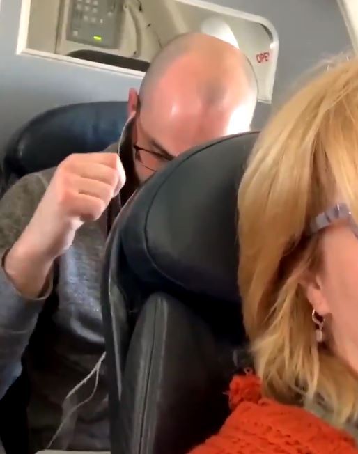 A woman went viral after she filmed a man punching her seat when she reclined it
