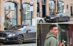 Man United star Chris Smalling parks luxury Bentley across a bus stop as he picks up some lunch