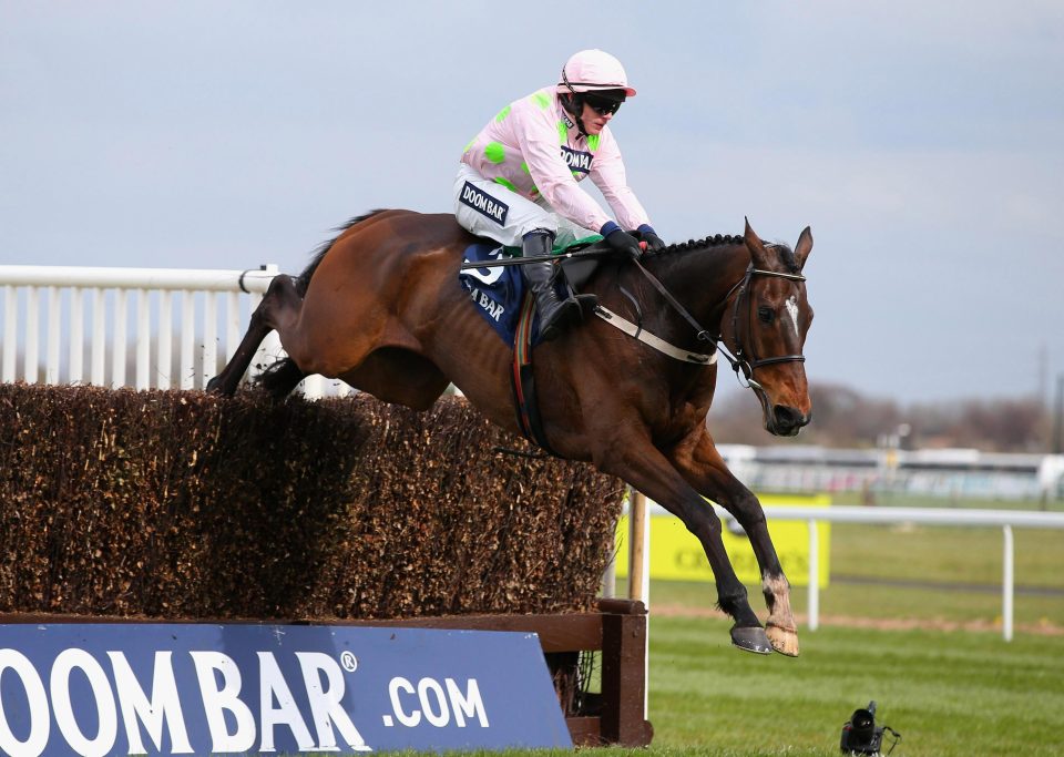 Douvan ridden by Paul Townend jumps the second last fence during their victory in the Doom Bar Maghull Novices' Steeple Chase at Aintree