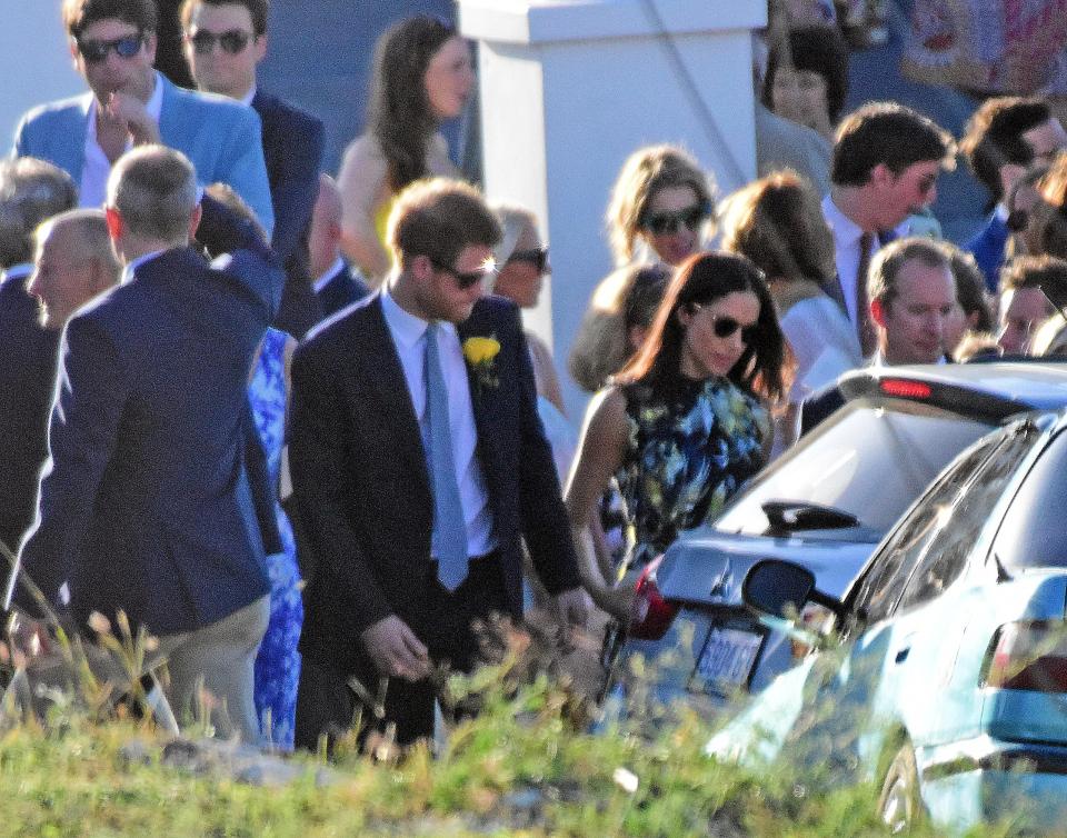 The loved up couple were spotted holding hands as they walked away from the wedding crowd