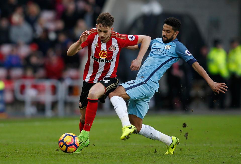 Januzaj tries to skip past a challenge from Man City left-back Gael Clichy