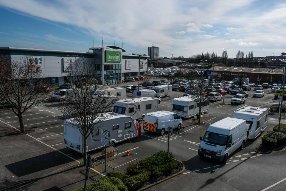  The car park has been invaded by more than a dozen caravans as travellers camp outside the large furnishings retailer