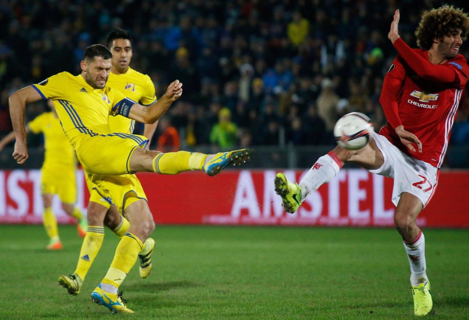 FC Rostov's Aleksandru Gatcan in action with Marouane Fellaini