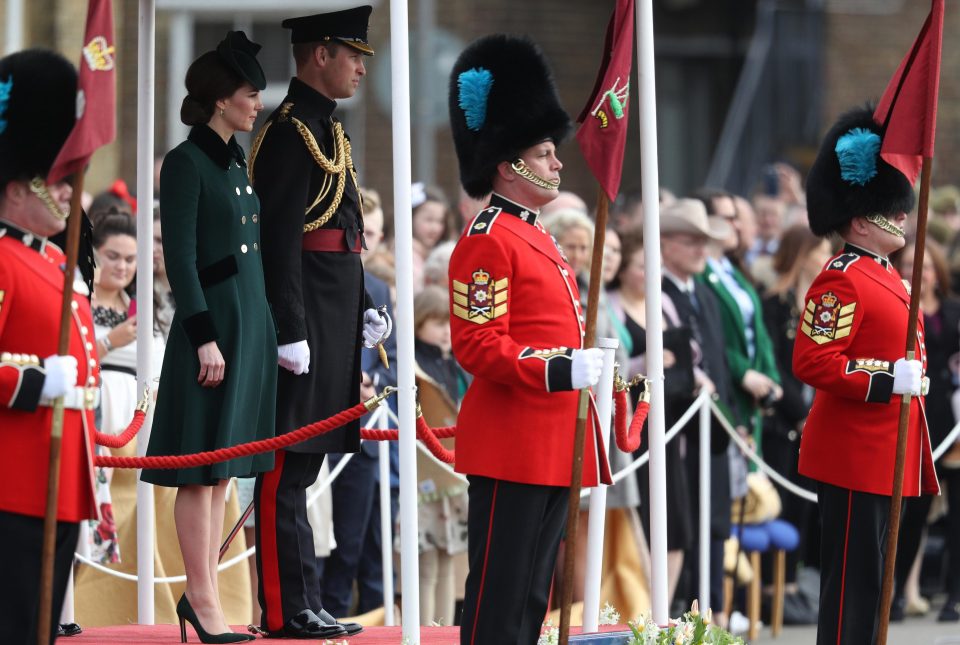  The royal couple stand as the 1st Battalion Irish Guardsmen leads the annual Irish Guards' St Patrick's Day Parade