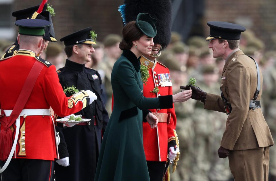  The Duchess is pictured here presenting a shamrock to one of the officers from the 1st Battalion Irish Guardsmen