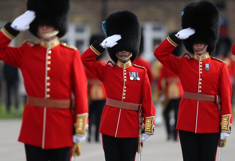  Officers from the 1st Irish Battalion Guardsmen salute as part of the annual parade