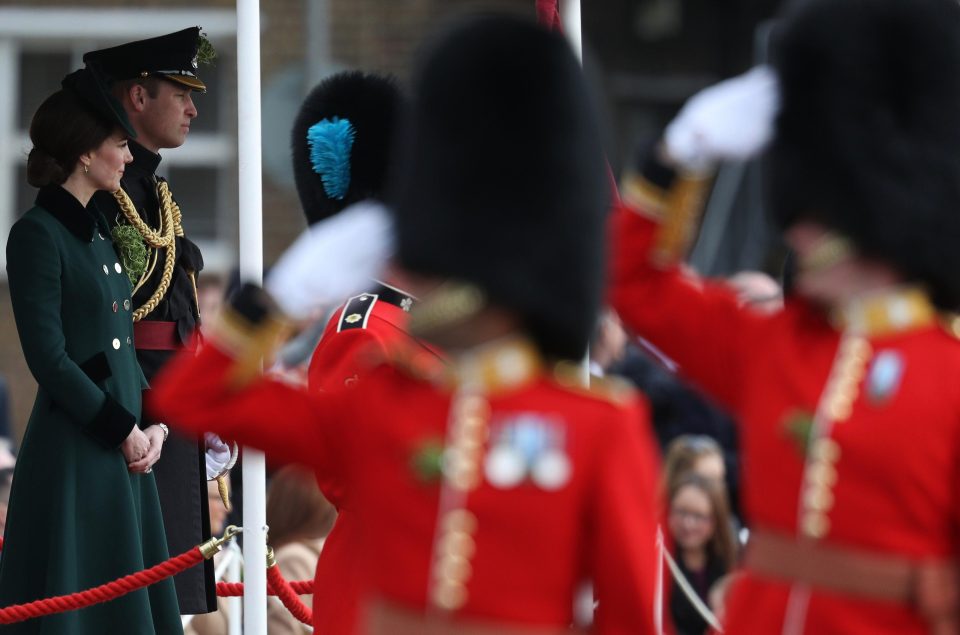  The Duke and Duchess watch on as the officers parade in front of them - with Kate appropriately wearing green for the day