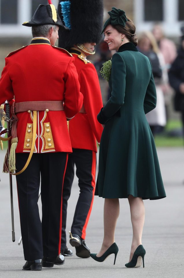  The Duchess shares a joke with an officer as they walk from the presentation of the shamrocks