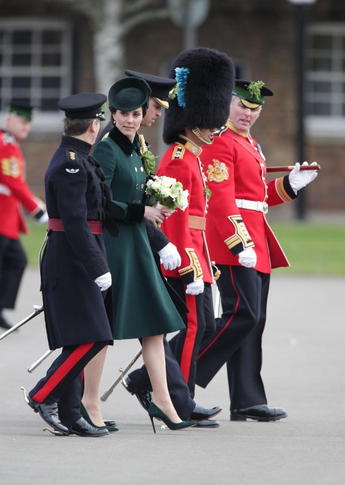  The royal couple are seen here walking with members of the 1st Irish Battalion Guardsmen after the annual parade