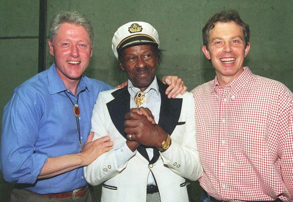  Berry meets then-US president Bill Clinton and British prime minister Tony Blair in 1997