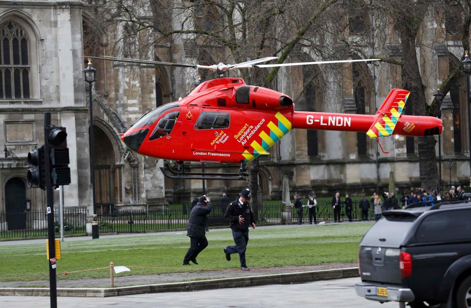 The air ambulance lands in Parliament Square