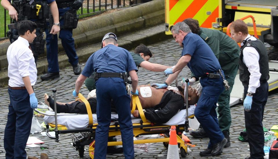 Emergency services at the scene outside the Palace of Westminster, London, after policeman has been stabbed and his apparent attacker shot by officers in a major security incident