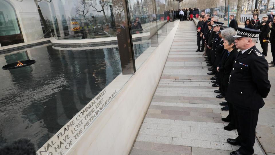 Officers formed a line as they paid their respects to the lives lost
