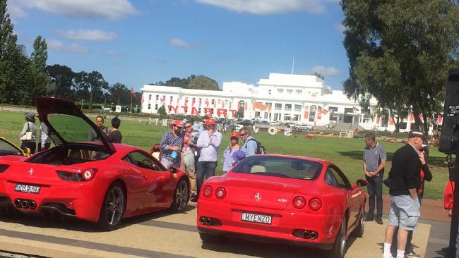 Green lawn, white walls, blue skies = fast car perfection