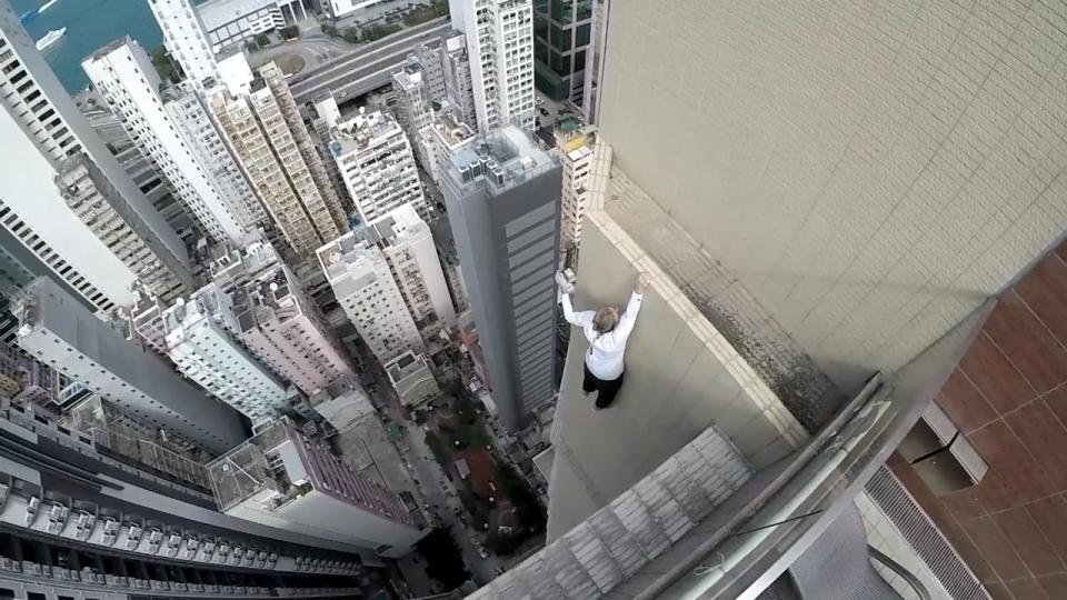  YouTube star Oleg Sherstayachenko performs his morning workouts dangling off buildings