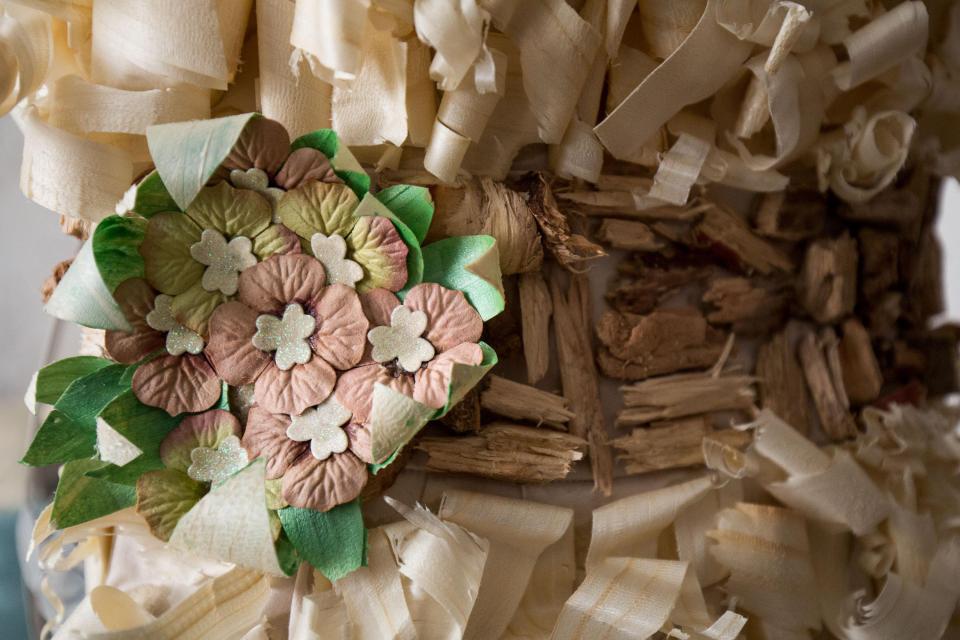  A close-up of the dress shows the intricate wood shavings, which were taken from pallets
