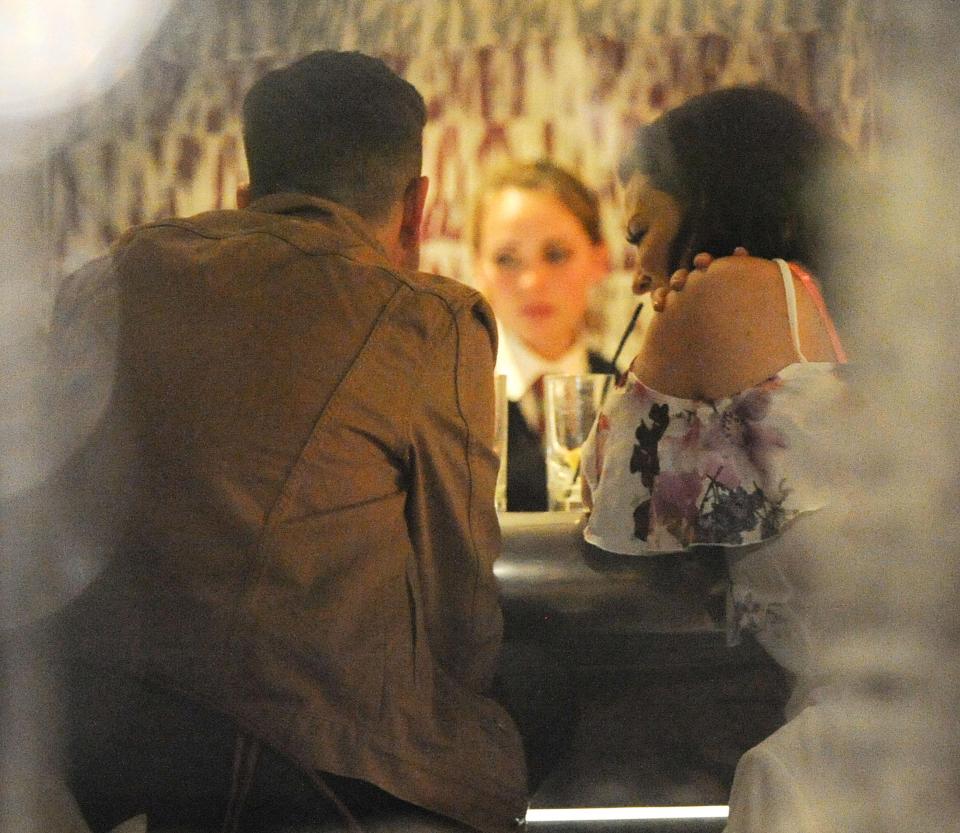  The pair looked like they were on a date at a glitzy bar