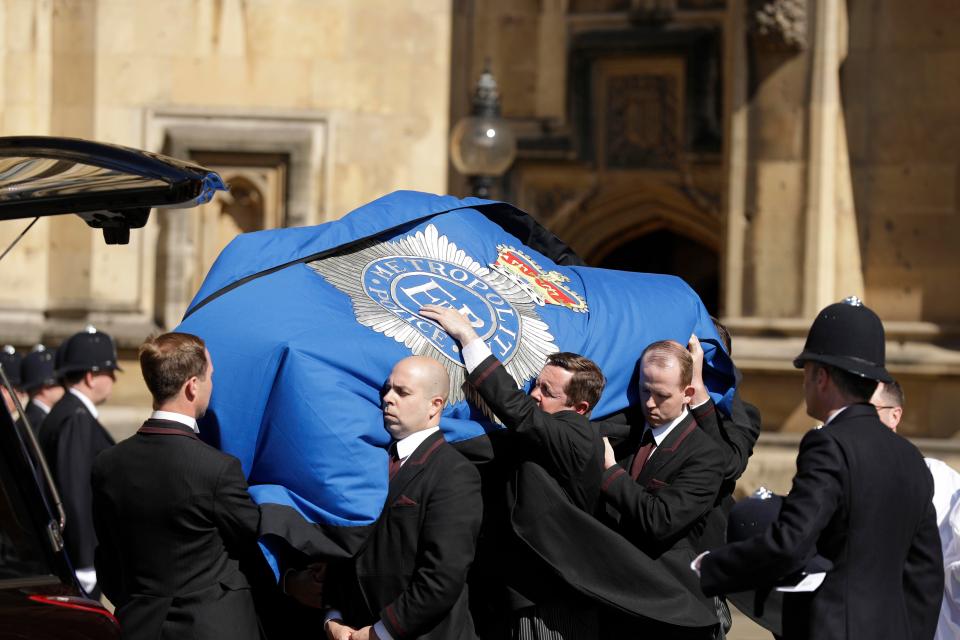  PC Palmer's coffin was covered with the Metropolitan emblem as it was brought into the Palace of Westminster