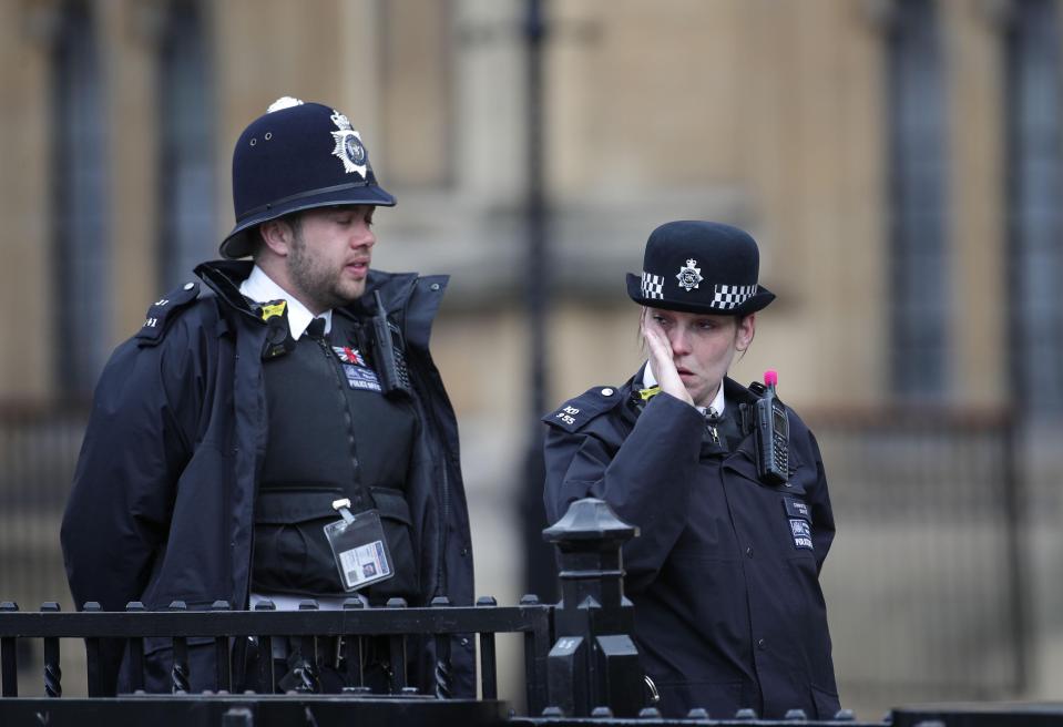  Police officers were visibly moved as they watched the funeral preparations for PC Palmer