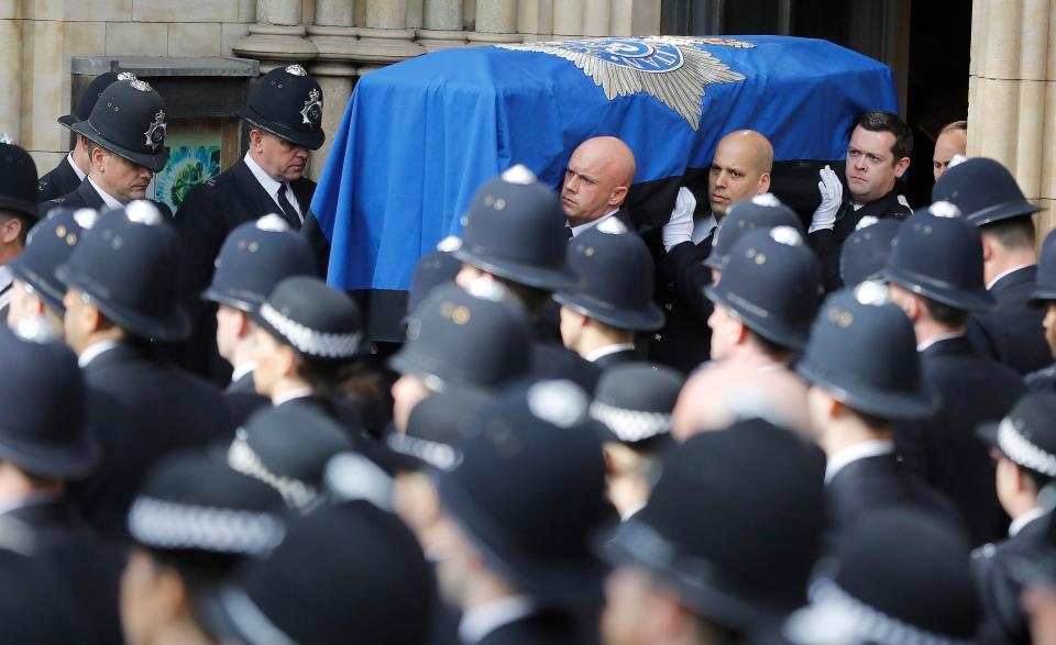  PC Palmer's coffin is carried from Southwark Cathedral after an emotional service