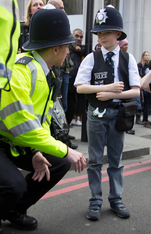 Paul was among thousands of officers at the funeral and told them he wants to join the force and 'protect our country'