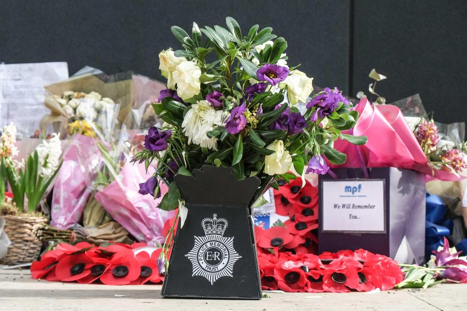  Floral tributes left at the National Police Memorial for officers killed in the line of duty