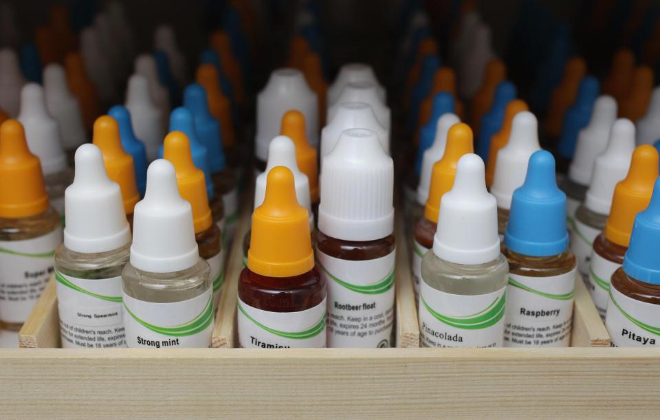 Public Health Wales has called for flavoured e-cigarette liquids to be banned amid fears they entice kids to try vaping