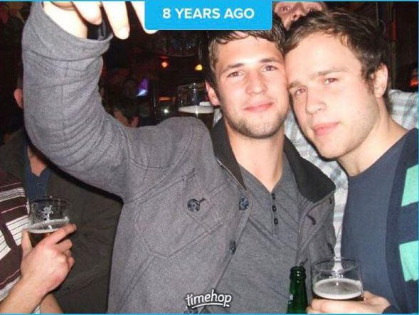  In another shot, he enjoys a beverage with his friend Lorenzo, going to cheek to cheek with his friends as he gives a sultry stare.