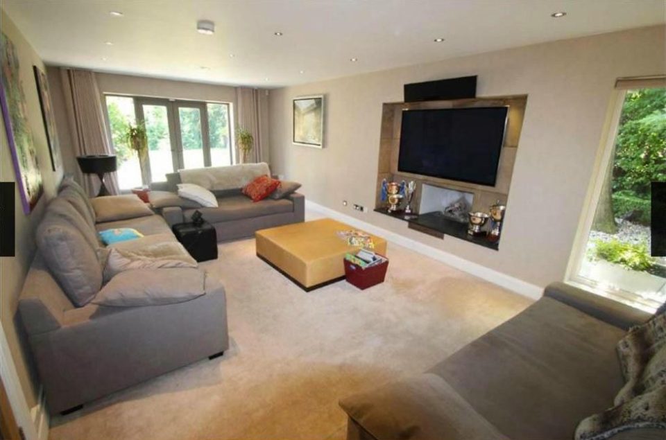 The spacious front room with big screen TV in David De Geas mansion