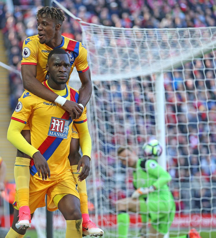 Wilfried Zaha celebrates as former Liverpool striker Christian Benteke hits a stoppage-time winner at Anfield 