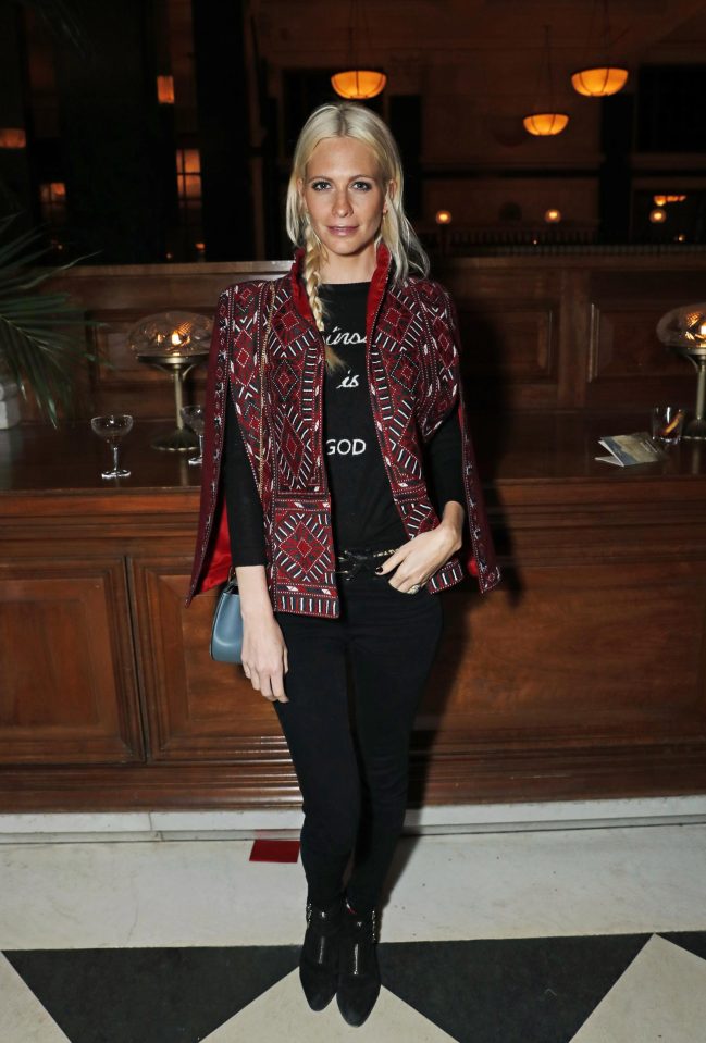  Poppy Delevingne rocked a poncho to the packed event