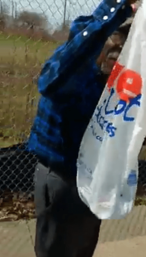 Mr Goodwin is shown holding his arms up in fear