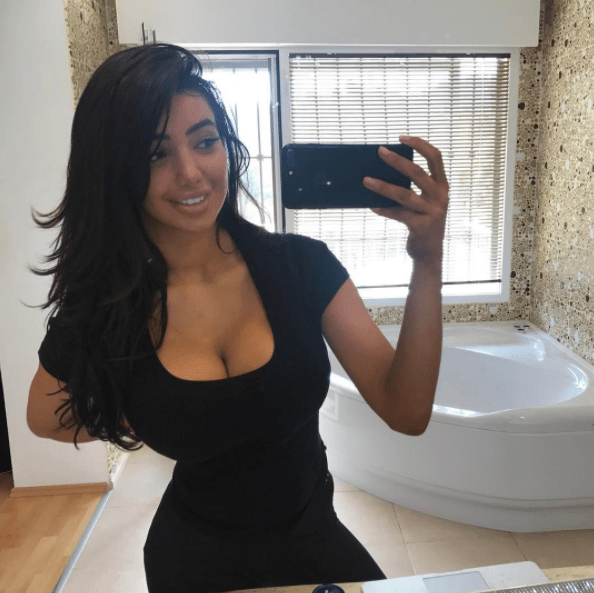 Chloe stripped herself of all make-up to show off her tiny waist