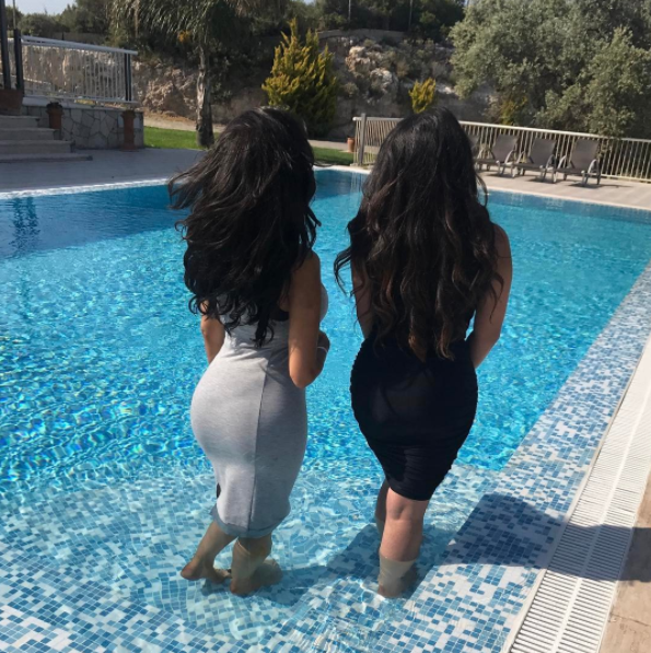Chloe did not care that her dress got wet as she showed off her enhanced bottom