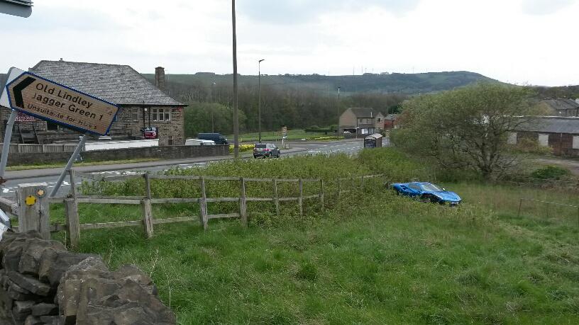 The high-end vehicle appears to have ploughed through a wooden fence after leaving the road